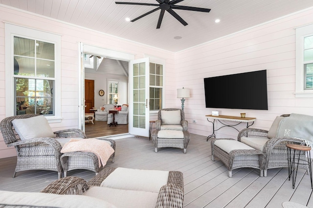 wooden deck featuring an outdoor hangout area and ceiling fan