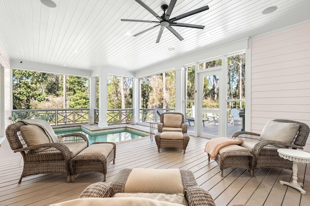 sunroom / solarium featuring wooden ceiling and a ceiling fan