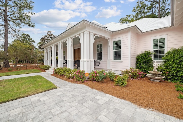 359 Wood Beach Dr, Santa Rosa Beach, FL 32459 - view of side of home with metal roof and covered porch