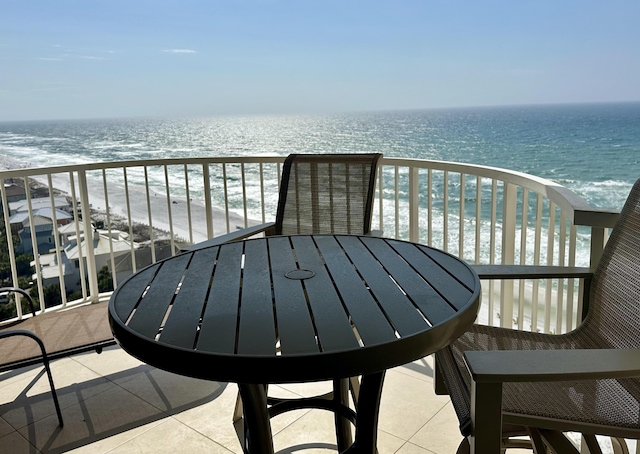 balcony with a view of the beach and a water view