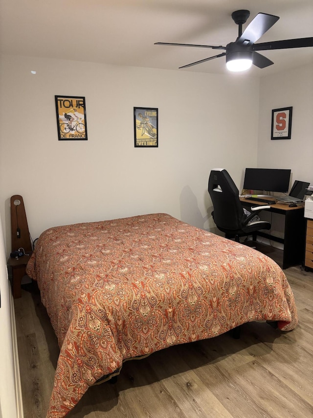 bedroom featuring a ceiling fan and wood finished floors