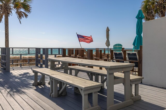 wooden terrace with a water view