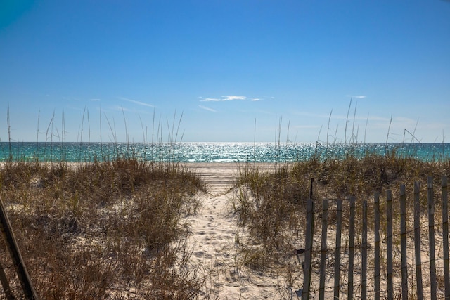 property view of water featuring a beach view