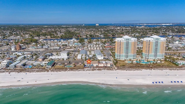 birds eye view of property featuring a view of the beach and a water view