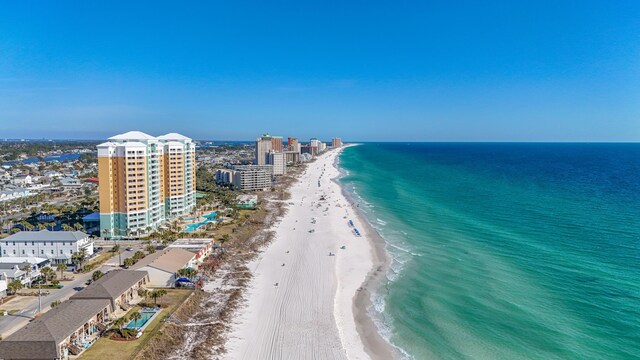 birds eye view of property featuring a view of the beach, a view of city, and a water view