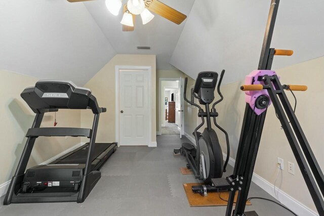 exercise room with a ceiling fan, lofted ceiling, baseboards, and visible vents