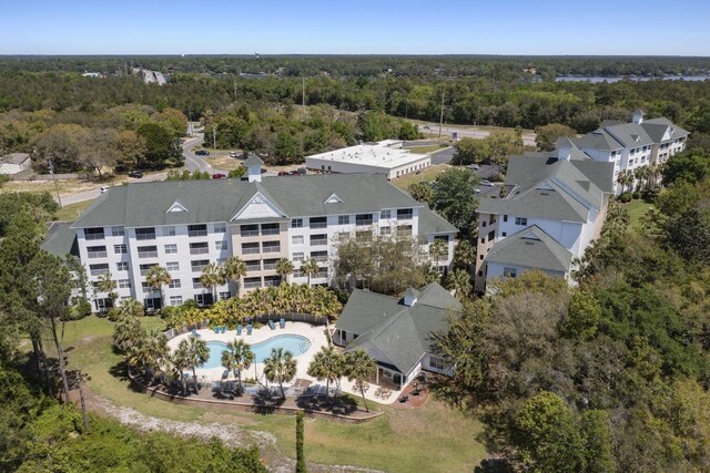 drone / aerial view featuring a view of trees