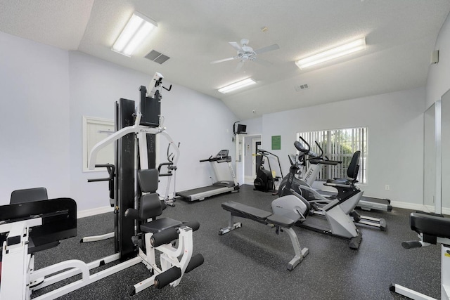 workout area featuring visible vents, baseboards, and vaulted ceiling