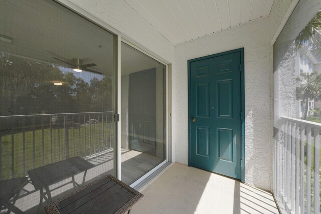 view of exterior entry with stucco siding