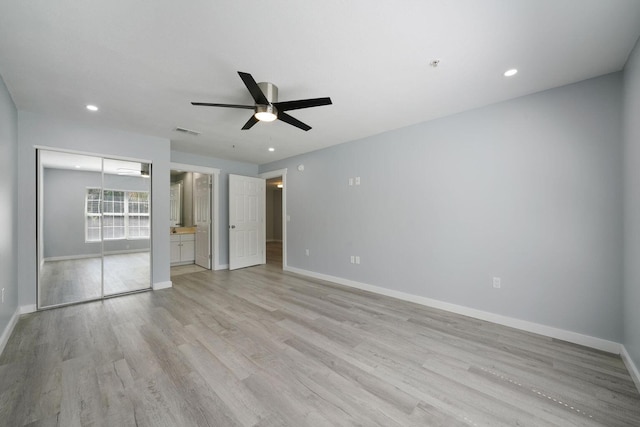 unfurnished bedroom with light wood finished floors, visible vents, baseboards, recessed lighting, and ensuite bathroom