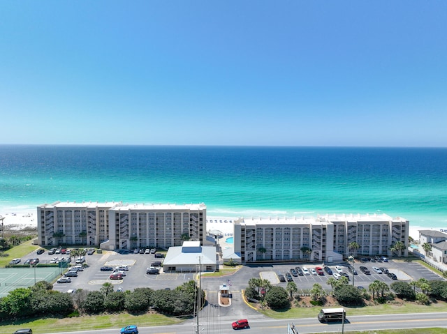 drone / aerial view featuring a water view and a view of city