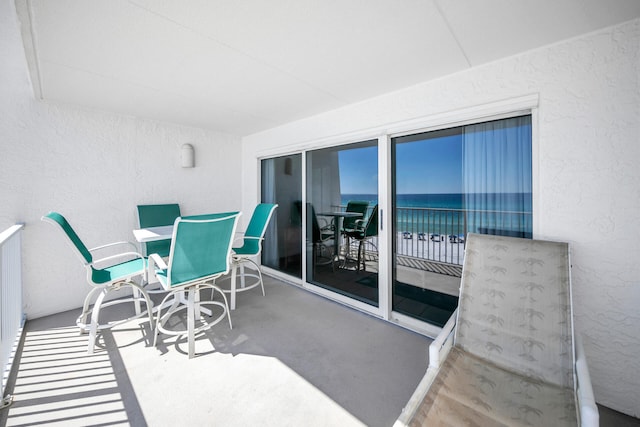balcony featuring a water view