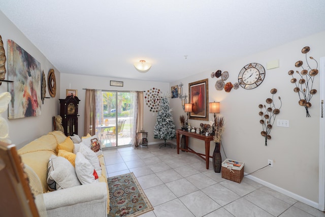 living area with light tile patterned floors and baseboards