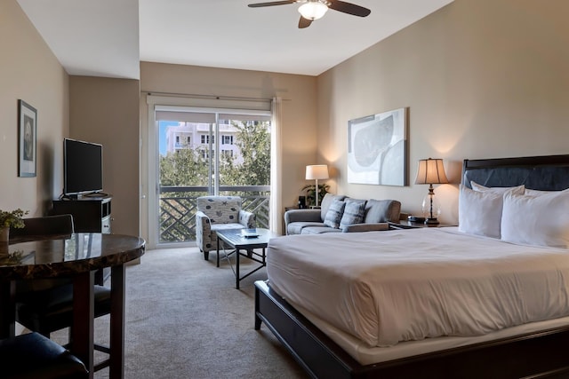 carpeted bedroom featuring a ceiling fan and access to outside