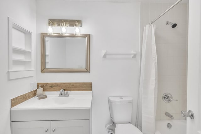 bathroom featuring shower / tub combo, toilet, and vanity