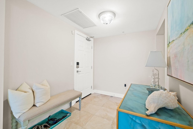 interior space with visible vents, attic access, and baseboards