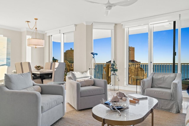 living area featuring floor to ceiling windows and ornamental molding