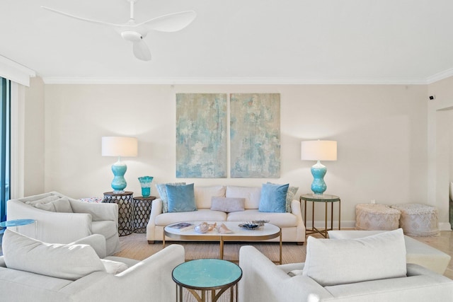 living room featuring ceiling fan, wood finished floors, baseboards, and ornamental molding