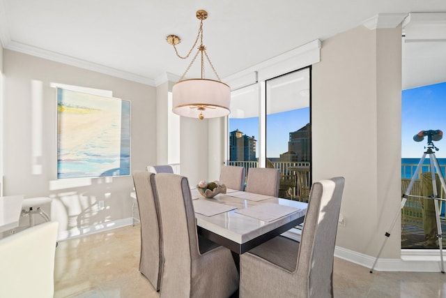 dining space featuring baseboards and ornamental molding