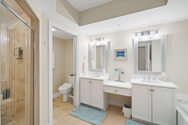 bathroom with tile patterned floors, a shower stall, toilet, and vanity