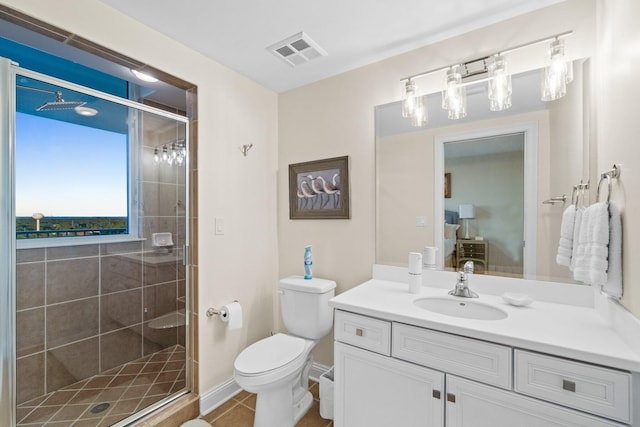 bathroom with visible vents, toilet, a stall shower, tile patterned floors, and vanity