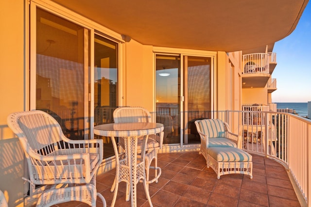 balcony featuring a water view