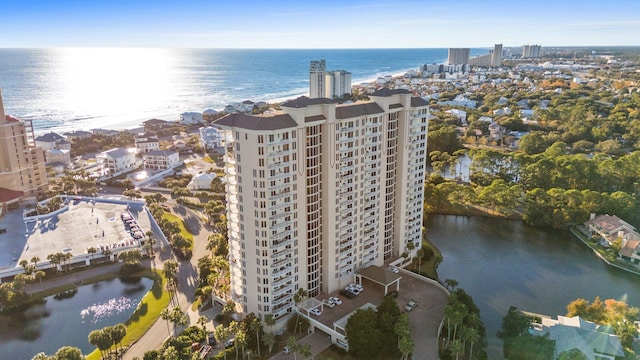 drone / aerial view featuring a view of city and a water view