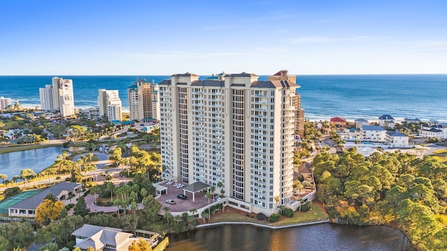 birds eye view of property featuring a water view and a city view