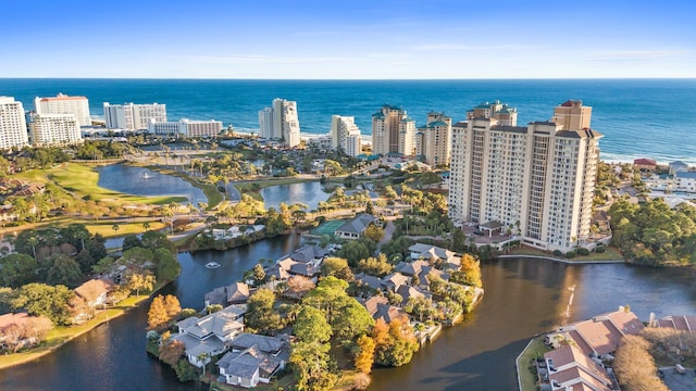 birds eye view of property featuring a city view and a water view