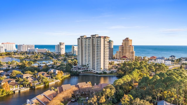 birds eye view of property with a view of city and a water view