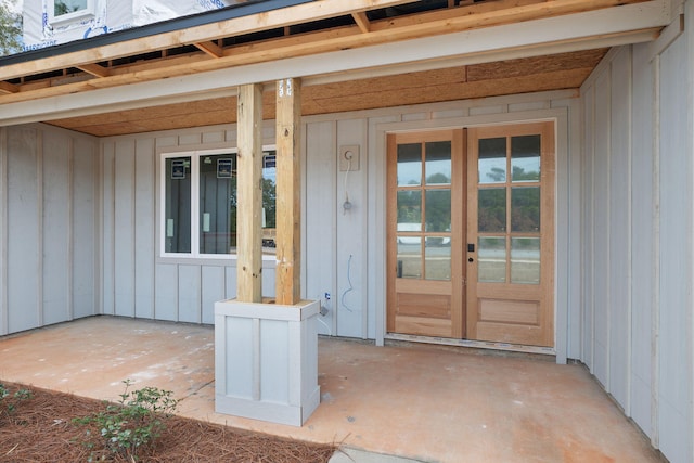 entrance to property featuring board and batten siding