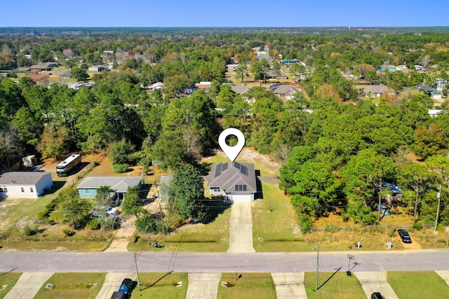 bird's eye view featuring a wooded view