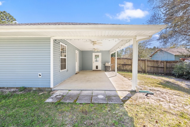 view of patio with a ceiling fan and fence