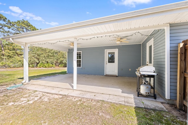 view of patio / terrace with ceiling fan and a grill