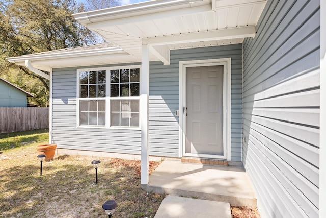 property entrance with fence