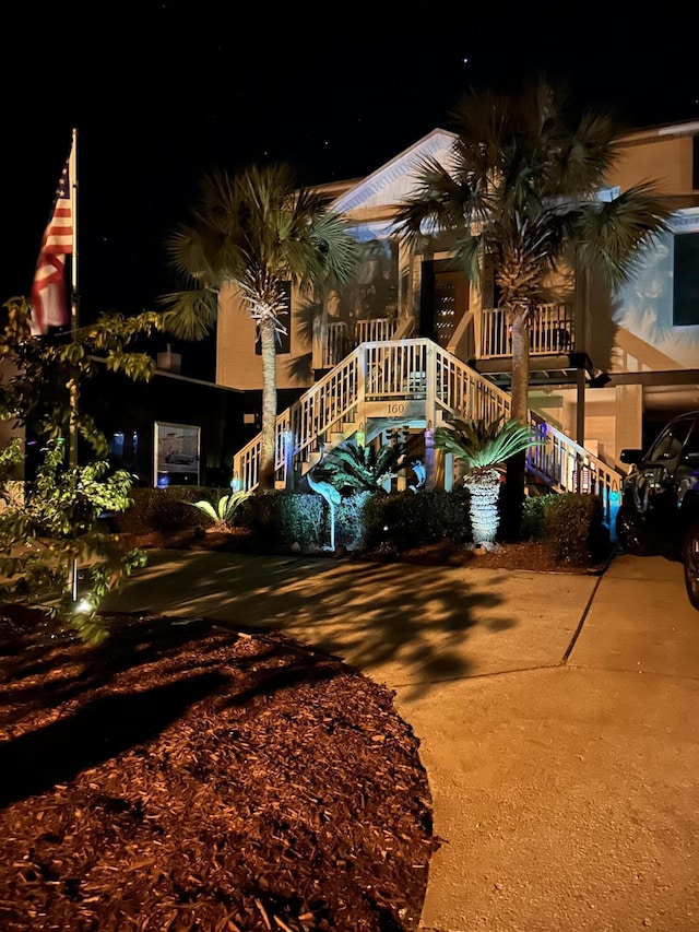 view of front facade featuring stairs