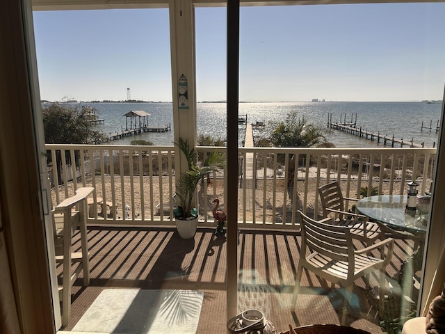 balcony featuring a water view