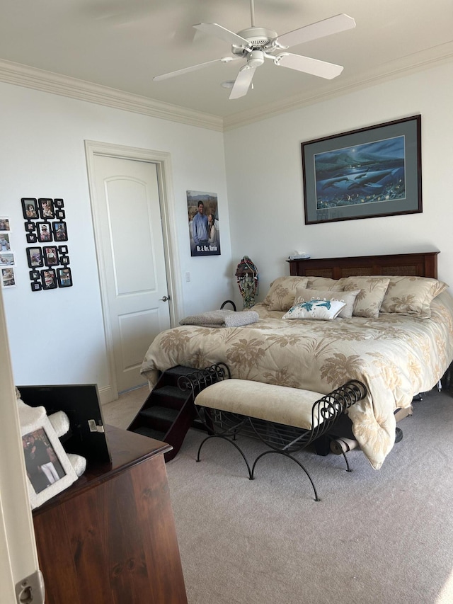 bedroom featuring carpet flooring, crown molding, and a ceiling fan