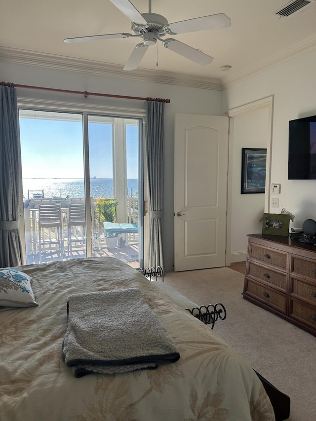 carpeted bedroom with visible vents, crown molding, a ceiling fan, and access to outside