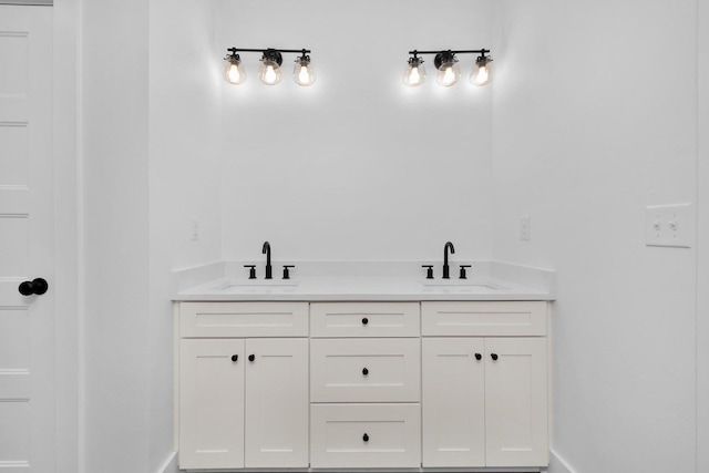 bathroom featuring double vanity and a sink