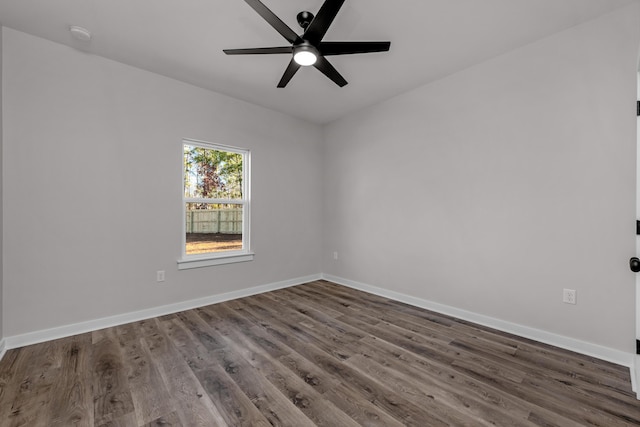 spare room with ceiling fan, baseboards, and wood finished floors