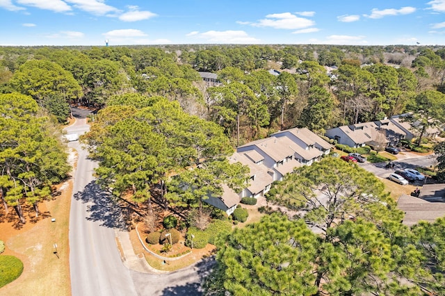 drone / aerial view featuring a forest view