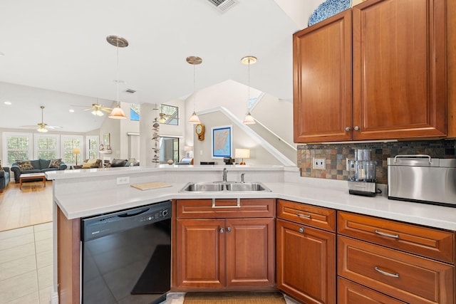 kitchen with tasteful backsplash, open floor plan, dishwasher, a peninsula, and a sink