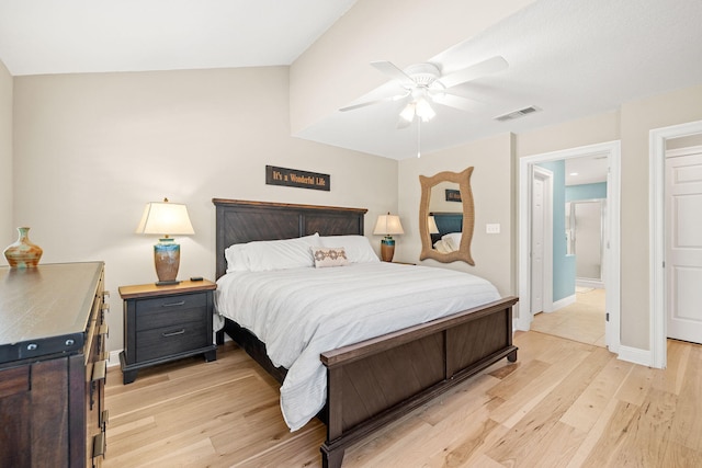 bedroom with ceiling fan, visible vents, baseboards, and light wood-style flooring