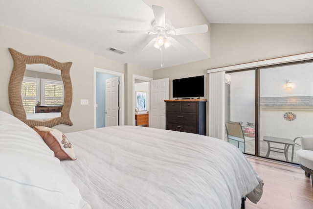 bedroom with access to exterior, visible vents, ceiling fan, lofted ceiling, and wood finished floors