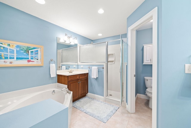 bathroom featuring vanity, recessed lighting, a stall shower, tile patterned flooring, and toilet