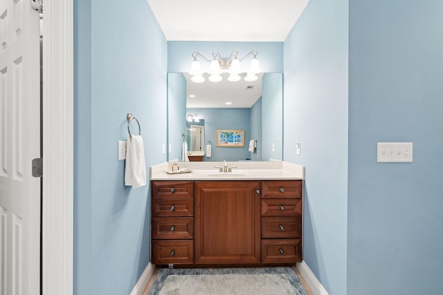 bathroom featuring vanity and baseboards