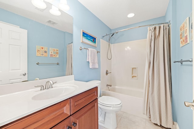 bathroom with vanity, shower / bathtub combination with curtain, visible vents, tile patterned flooring, and toilet