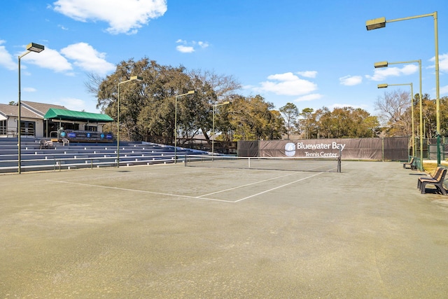 view of sport court featuring fence