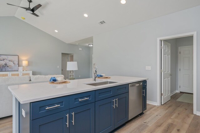 kitchen with light wood finished floors, visible vents, open floor plan, dishwasher, and a sink